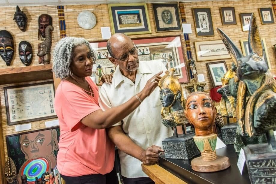 People examining African art